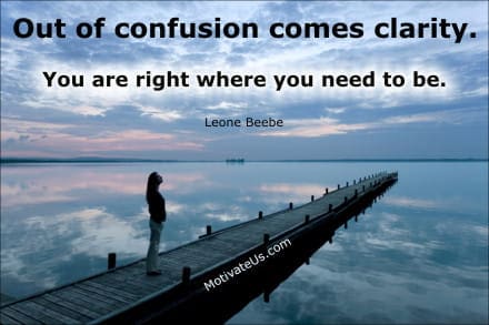 Inspirational Picture person standing on a long dock and an inspiring quote: Out of confusion comes clarity. You are right where you need to be.