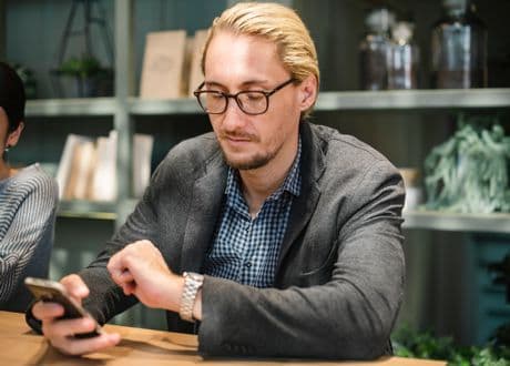How To Overcome Procrastination - What Is the Key? man looking at his watch