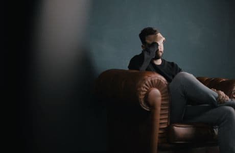 Face Your Fears man sitting with his head in his hands