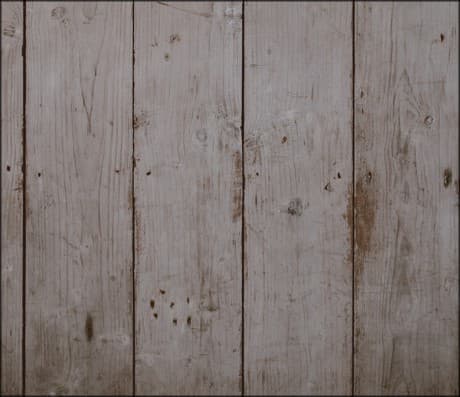 a fence with a lot of nail holes