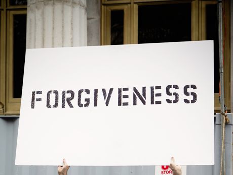 sign with forgiveness written on it