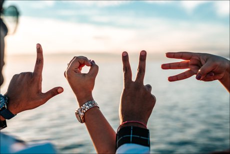 Inspirational Picture inspirational picture of 4 hands spelling out the word love.
