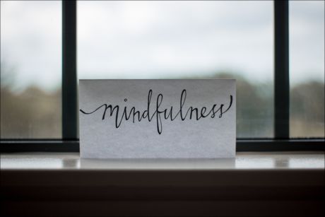 sign with mindfulness written on it