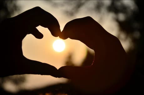 two handed heart sign