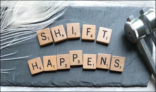 sign saying Shift Happens.