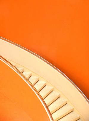 One Step At A Time steps on orange background
