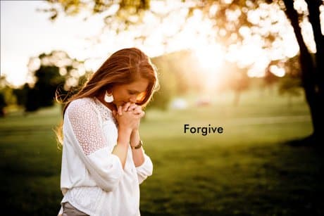 When you forgive someone you free yourself like the woman in the picture with her hands in prayer
