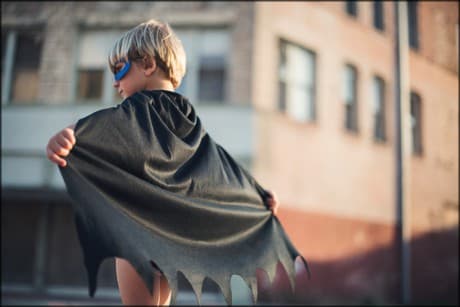 a child in a superhero costume