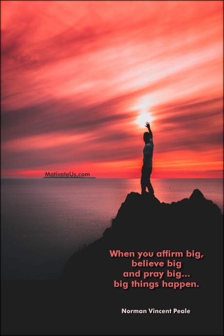 person standing on a rock